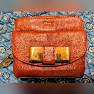 Chloe Women's Metallic Burgundy Leather Bag with Gold Accent In Good Condition!